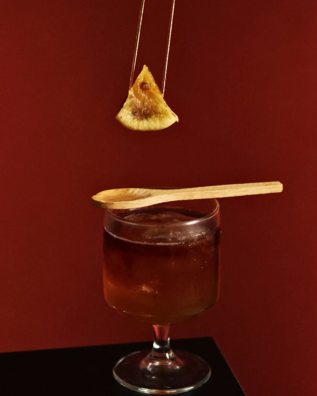 Amber cocktail with a caramelised fig garnish, Obscura Tirana